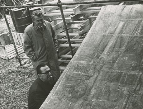 Umberto Baldini and Curtis Shell contemplate the damage on a painting