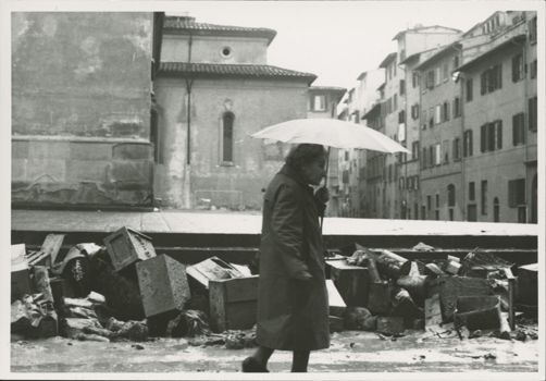 Elderly woman walks by Santo Spirito